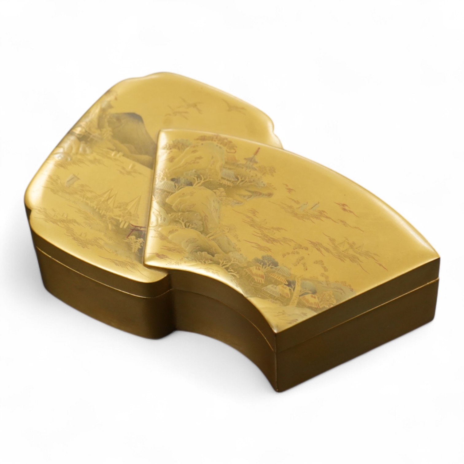 A Japanese gilt lacquer box depicting a mountainous landscape, 13.5cm wide